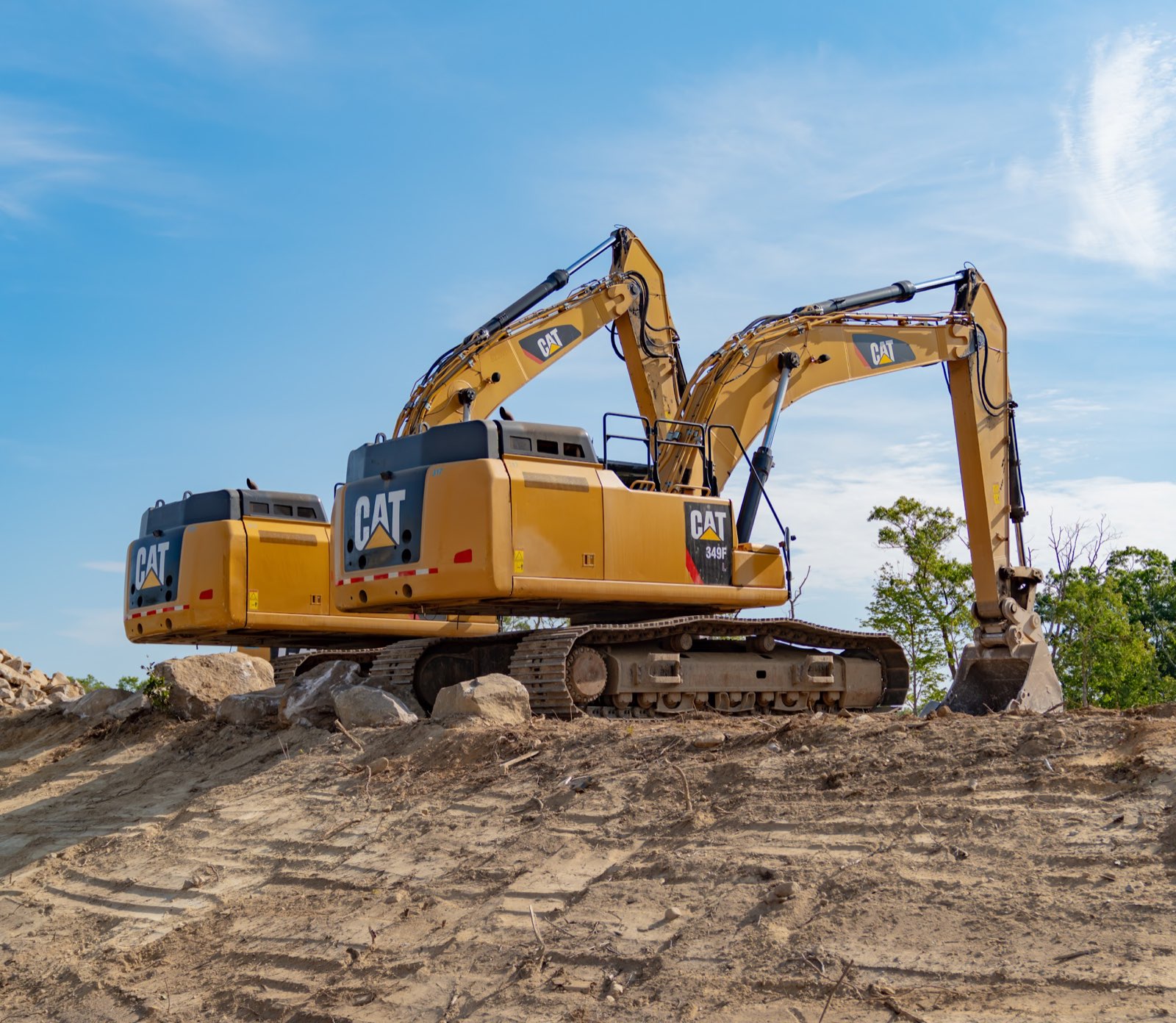 Two yellow excavators on rocky ground at the Applied Materials Logistics site in Gloucester.