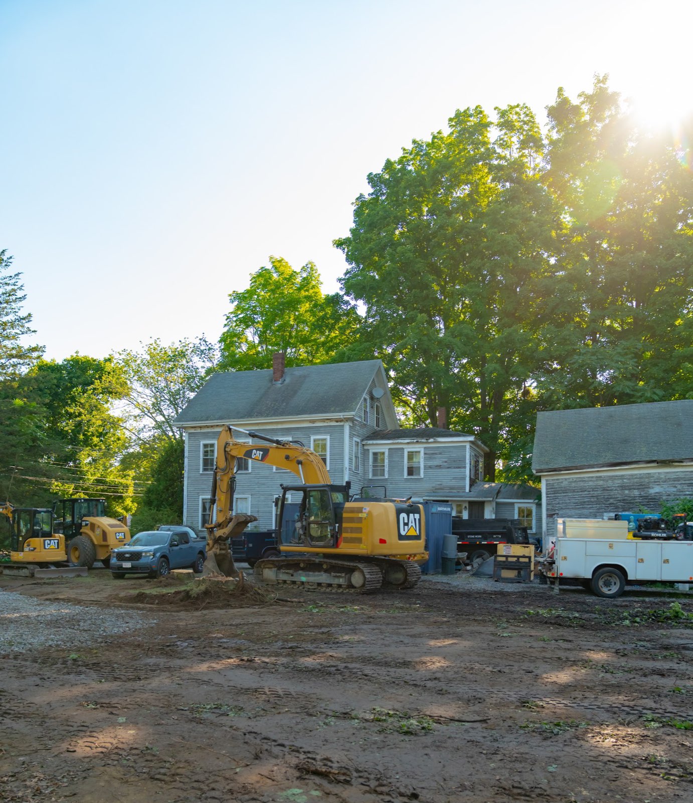 Excavators and construction vehicles outside the existing house at Timberwood Circle in Wakefield.