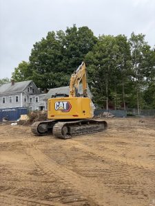 Tracked excavator on cleared ground at the Timberwood Circle residential development site.