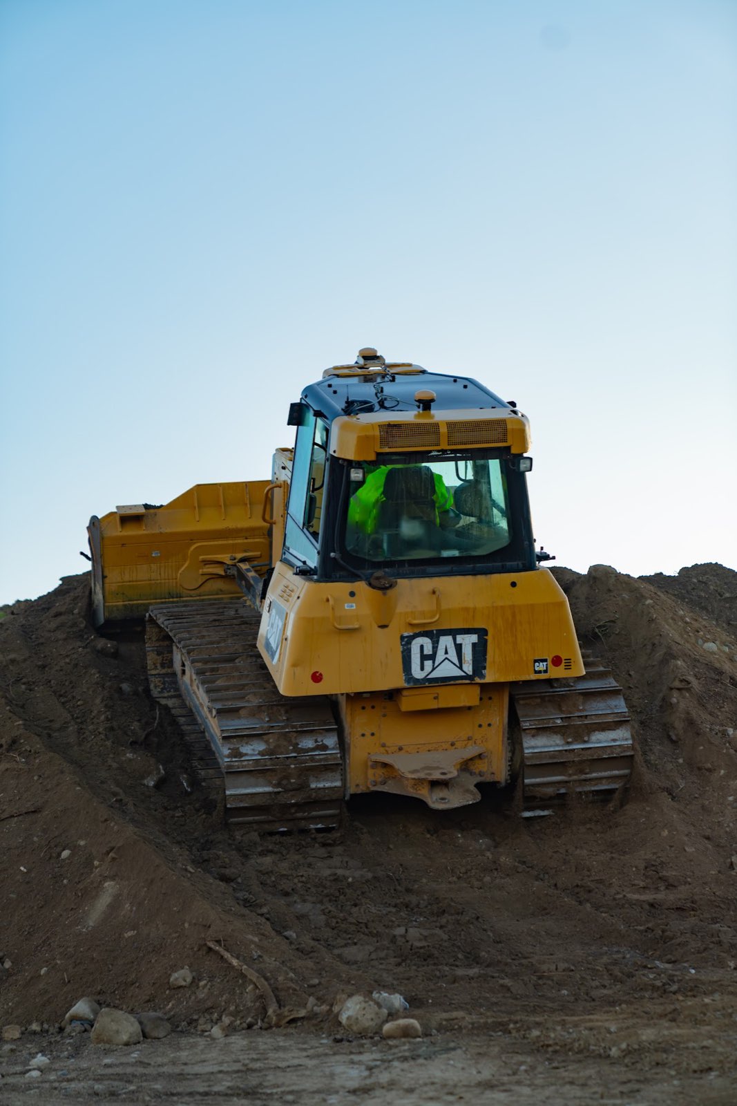 Bulldozer grading soil at the Waterhouse senior housing construction site.